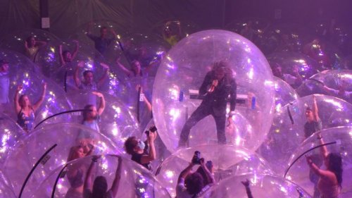 The Flaming Lips performed a concert with the band and fans encased in plastic bubbles