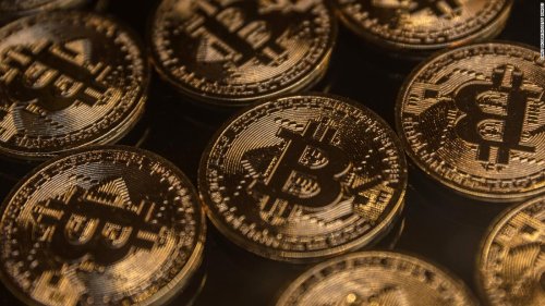Bitcoin value tumbles almost 50% since record November