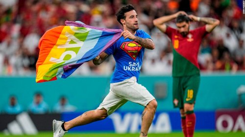 Pitch invader with rainbow flag interrupts World Cup match between Portugal and Uruguay