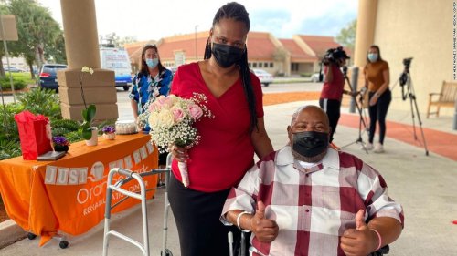 A couple got married in a hospital parking lot after the groom recovered from Covid-19