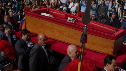 Under a basilica’s splendor, thousands gather for a final glimpse of a pope who led a simple life