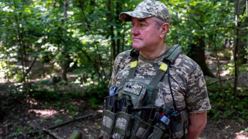 Deep in the eastern Ukrainian forest, this group of volunteers waits as Russia's military creeps closer