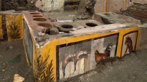 Ancient snack stall uncovered in Pompeii, revealing bright frescoes and traces of 2,000-year-old street food