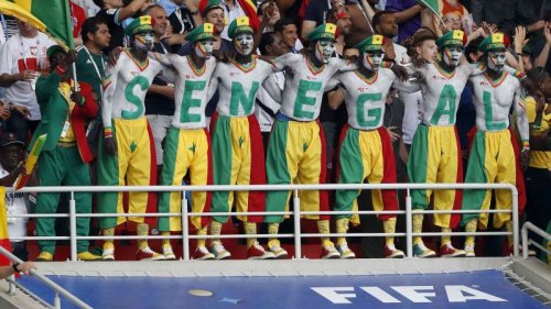 Japan and Senegal fans help to clean up World Cup stadiums