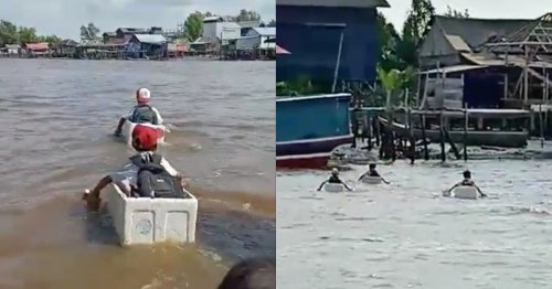 Elementary school boys cross river on styrofoam boxes in Indonesia (Video)