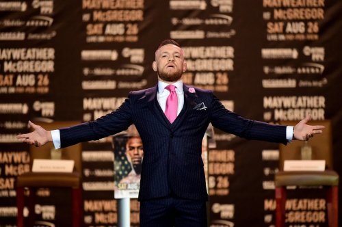 The Story Behind Conor McGregor’s Pinstripe “F*CK YOU” Suit