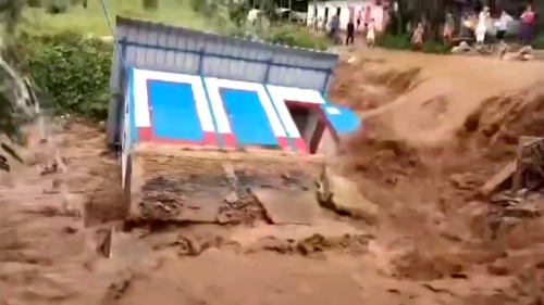 Raging floodwaters lead to building collapse in Thailand