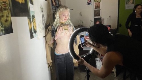 Grimes shows off "post-human" chest tattoo