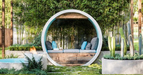 This award winning garden design uses concrete pipes to create seating, a water feature, and a fire pit