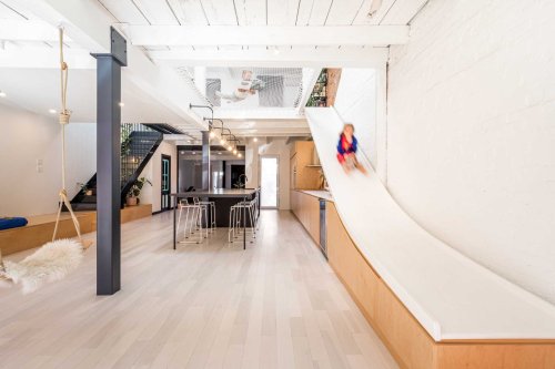 A Slide Is A Fun Alternative To The Stairs Inside This Home