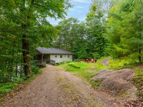 This cottage on a sunny lot is listed for $1 million, but it comes fully furnished