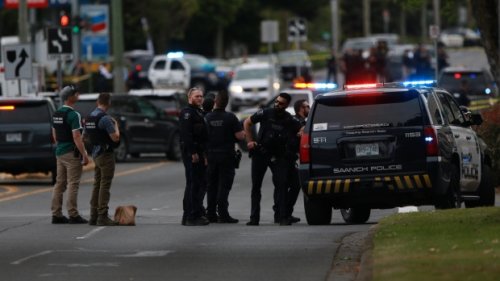 Two suspects dead, six officers shot after B.C. bank shooting.