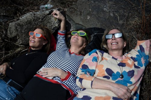Howling at the moon on a Monday afternoon. Eclipse brings thousands to Vermont.