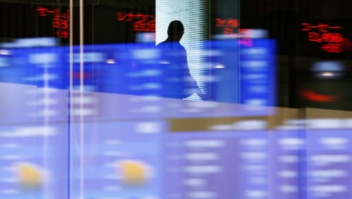 North American stock markets up in late-morning trading, loonie edges up