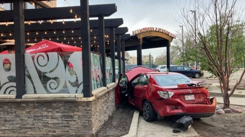 Car rams park bench, nearly goes through Boston Pizza