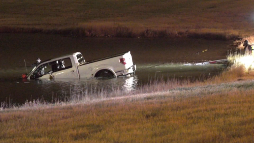 Pickup truck pulled from retention pond along Stoney Trail, no sign of driver