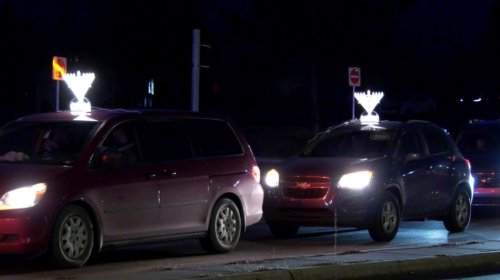 Calgary drivers light up streets with menorahs to celebrate first day of Hanukkah