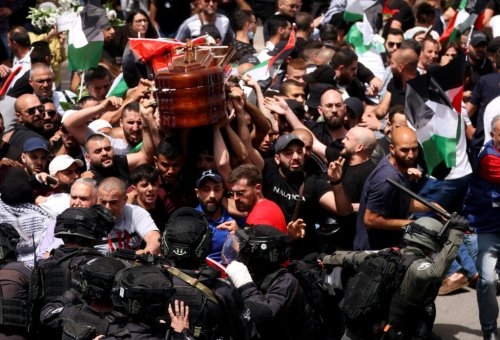 Israeli police beat pallbearers at journalist’s funeral, casket dropped