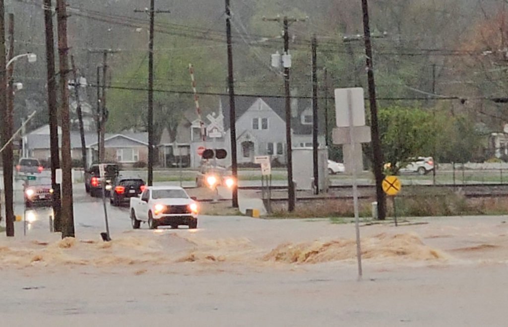 Rising rivers, flash floods hit waterlogged communities still recovering from tornadoes