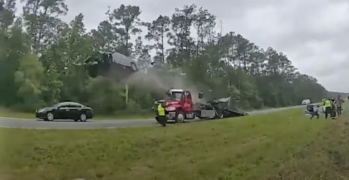Jaw-dropping footage shows car flying off tow truck ramp