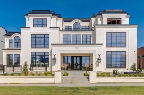 A palatial $13.5M Calgary mansion has a two-story library and downtown views