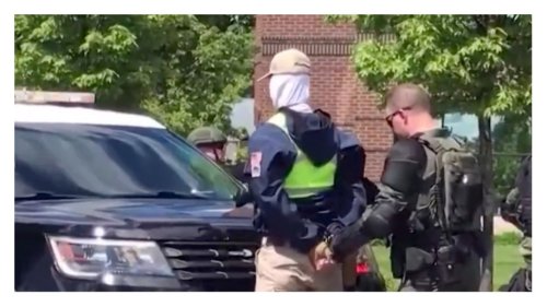 31 members of Patriot Front nationalist group arrested, found headed to Pride event with riot gear