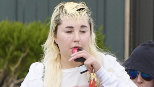 Amanda Bynes, 39, vapes while flashing her tummy in a crop top... after joining OnlyFans