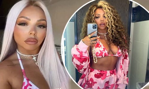 Jesy Nelson flaunts her cleavage and gym-honed midriff in a pink and white bikini as she tries on different wigs