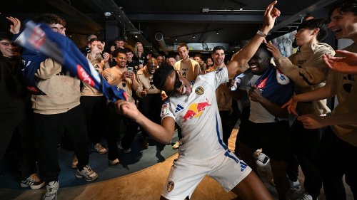 Inside Leeds' promotion celebrations: Former Man United youngster in the thick of it with the mic as players party and fans gather outside Elland Road in their thousands