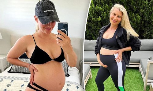 Tiffiny Hall shows off her huge baby bump in a tiny black bikini