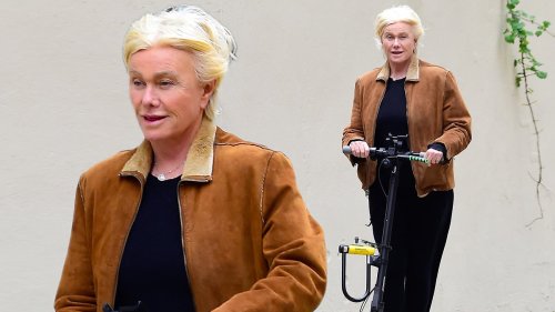 Deborra-Lee Furness smiles as she zips around New York on a scooter
