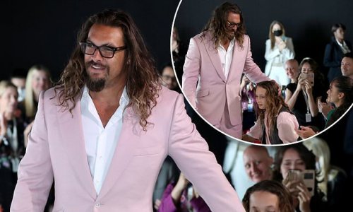 Jason Momoa cuts a dapper figure in a pink suit as he spends quality time with his children at the United Nations Oceans Conference in Portugal