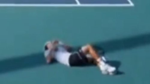 Tennis player COLLAPSES mid-match at the Miami Open as medic rushes on to help before he's taken off...