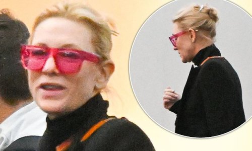 Cate Blanchett wears quirky red-hued glasses as she arrives in New York... after it emerged her eco-friendly plans to install 90 solar panels at her Sussex mansion might be scuppered