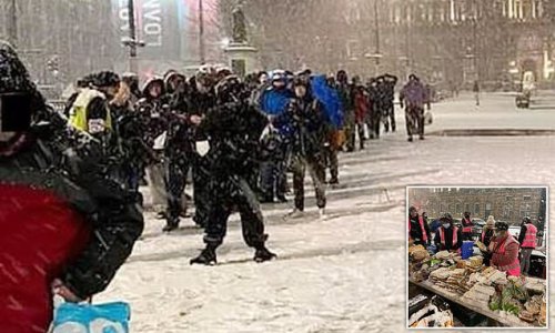 Outrage as hundreds forced to queue in the snow for hot food
