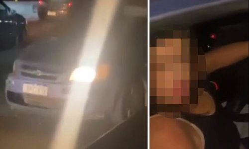 Terrifying footage shows a woman driving the WRONG way down a busy freeway before she crashed and caused a massive traffic jam