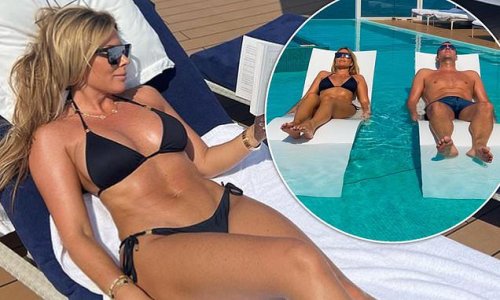Toni Terry Looks Sensational In A Black Bikini As She Lounges By A Pool During Holiday With
