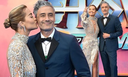 Rita Ora wows in a plunging embellished gown with a thigh-high split and shares a sweet kiss with fiancé Taika Waititi at Thor premiere