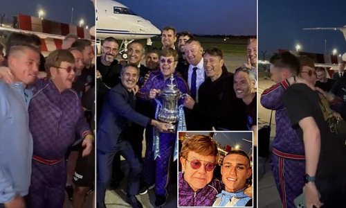 Can you feel the love tonight? Elton John greets Man City's FA Cup heroes on airport runway as they arrive home after Wembley final win over Man United - and Phil Foden can't resist asking the pop legend for a quick selfie!