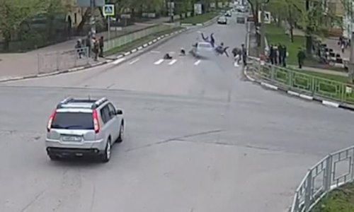 Horrifying moment four children are injured when Russian teenage driver jumps a red light and smashes into them on a pedestrian crossing