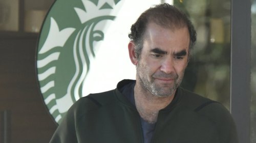 Tennis legend is completely unrecognizable as he is seen grabbing a coffee from Starbucks - three...