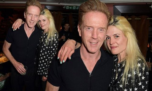 Damian Lewis and Alison Mosshart confirm their romance as they cosy up at private members' club bash... after her mum gave the actor her approval