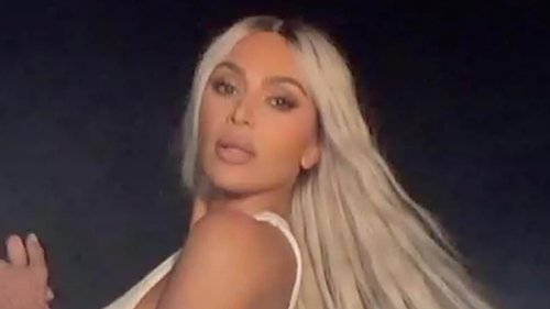 Kim Kardashian loves her new set of wheels as she rocks leather pants and a crop top for a steamy...