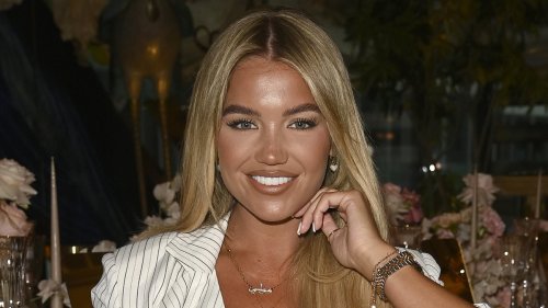 Love Island's Molly Smith cuts a stylish figure in a white co-ord as she celebrates her latest mega...