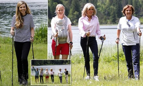 Keeping it casual! Carrie Johnson and Brigitte Macron lead the stylish G7 wives opting for low-key ensembles as they enjoy a walking tour around Lake Ferchensee in Germany