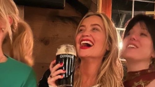 Holly Willoughby tucks into Guinness cakes at a boozy bash with pal Laura Whitmore as they lead the...