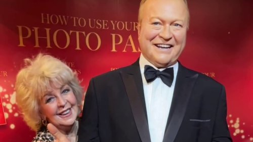 Emotional Patti Newton poses with late husband Bert's wax figure