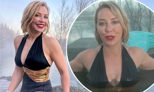 'It's a Winter Wonderland!': A Place In The Sun's Laura Hamilton showcases her incredible figure in a plunging black swimsuit for a dip in warm lagoon in Iceland
