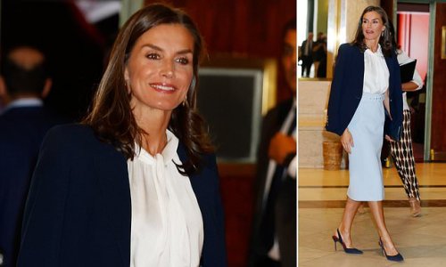 Perfectly polished! Queen Letizia of Spain steps out in a powder blue skirt and white blouse as she attends an awards ceremony in Madrid