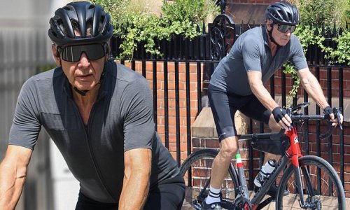 Harrison Ford shows off his toned physique as he cycles through London